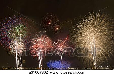Stock Image - Fireworks in night sky. Fotosearch