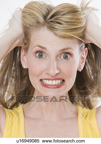Frustrated woman pulling on hair View Large Photo Image Stock Photography - Frustrated woman pulling on hair. Fotosearch