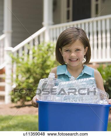 Girl carrying recycling bin View Large Photo Image Stock Photo - Girl carrying recycling bin. Fotosearch