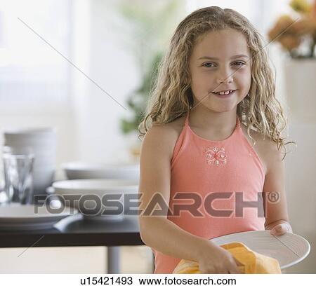 Girl drying off dish View Large Photo Image Stock Image - Girl drying off dish. Fotosearch