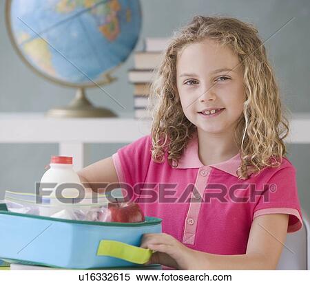 Girl eating lunch at school View Large Photo Image Stock Photography - Girl eating lunch at school. Fotosearch