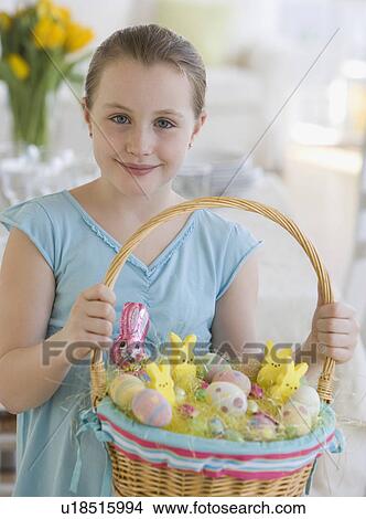 Girl holding Easter basket View Large Photo Image Picture - Girl holding Easter basket. Fotosearch