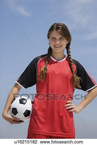 Girl holding soccer ball View Large Photo Image Stock Image - Girl holding soccer ball. Fotosearch