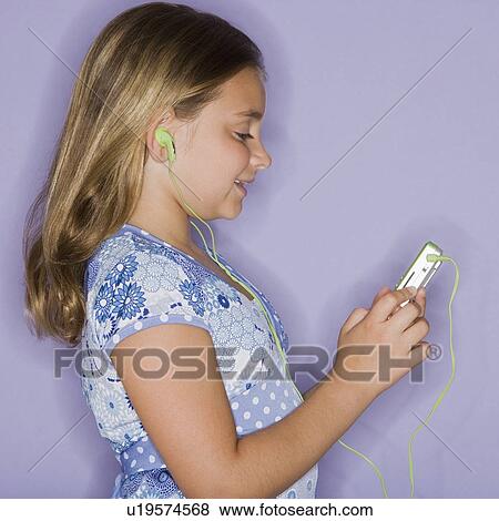 Girl listening to mp3 player View Large Photo Image Stock Photo - Girl listening to mp3 player. Fotosearch