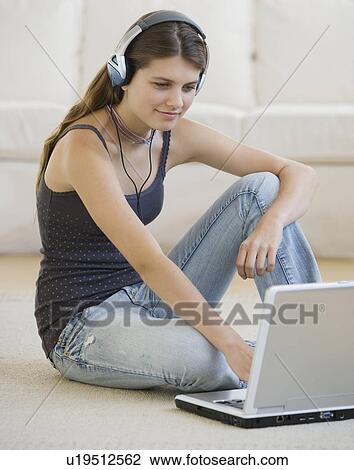 Girl looking at laptop View Large Photo Image Stock Image - Girl looking at laptop. Fotosearch