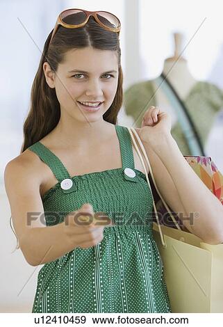 Girl paying with credit card View Large Photo Image Stock Photo - Girl paying with credit card. Fotosearch