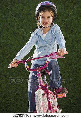 Stock Photo - Girl riding bicycle. Fotosearch