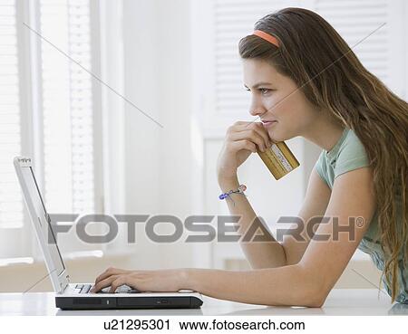Girl shopping online View Large Photo Image Stock Image - Girl shopping online. Fotosearch