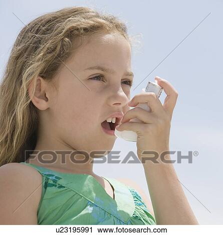 Girl using asthma inhaler View Large Photo Image Stock Image - Girl using asthma inhaler. Fotosearch