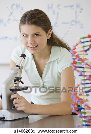 Girl using microscope View Large Photo Image Stock Photography - Girl using microscope. Fotosearch