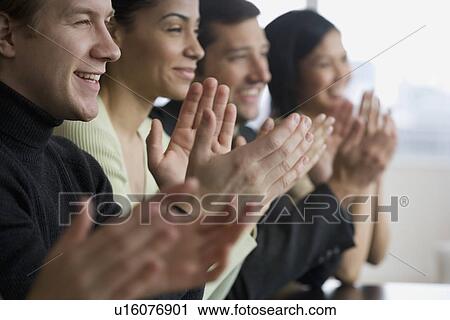 Group of businesspeople clapping at meeting View Large Photo Image Stock Image - Group of businesspeople clapping at meeting. Fotosearch