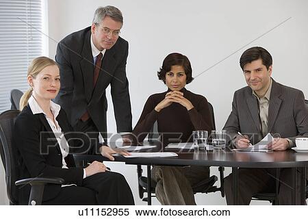 Stock Photography - Group of businesspeople in meeting. Fotosearch