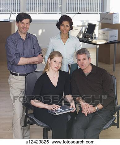 Stock Photography - Group of businesspeople in new office. Fotosearch