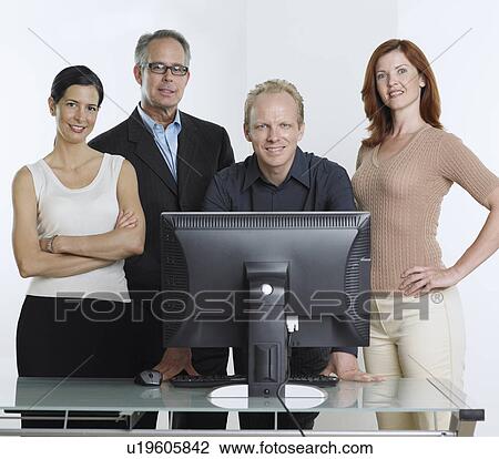 Group of businesspeople with computer View Large Photo Image Stock Image - Group of businesspeople with computer. Fotosearch