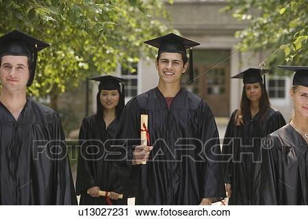 Group of college graduates holding diplomas View Large Photo Image Stock Image - Group of college graduates holding diplomas. Fotosearch
