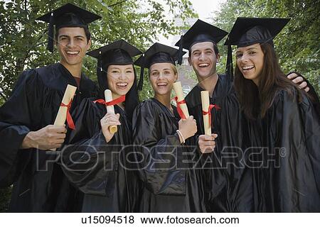 Group of college graduates holding diplomas View Large Photo Image Stock Photo - Group of college graduates holding diplomas. Fotosearch