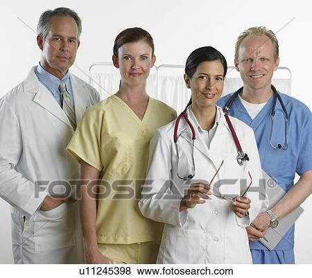 Group of male and female doctors smiling View Large Photo Image Stock Photo - Group of male and female doctors smiling. Fotosearch