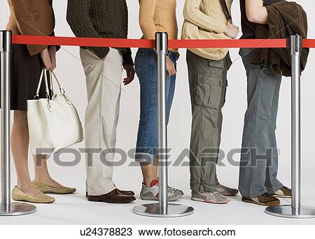 Group of people standing in line View Large Photo Image Stock Image - Group of people standing in line. Fotosearch