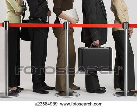 Stock Photo - Group of people standing in line. Fotosearch