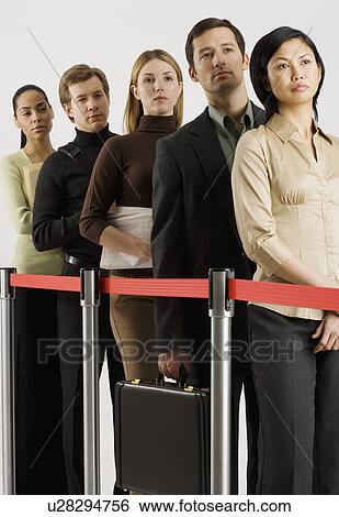 Group of people standing in line View Large Photo Image Stock Photograph - Group of people standing in line. Fotosearch