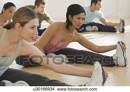 Group of people stretching View Large Photo Image Picture - Group of people stretching. Fotosearch