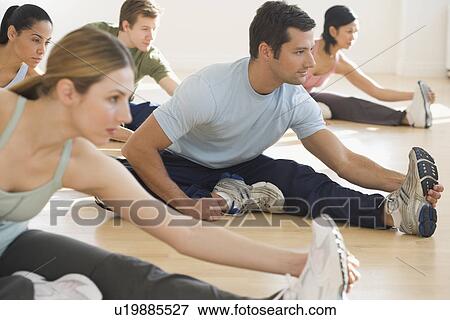 Stock Photo - Group of people stretching. Fotosearch
