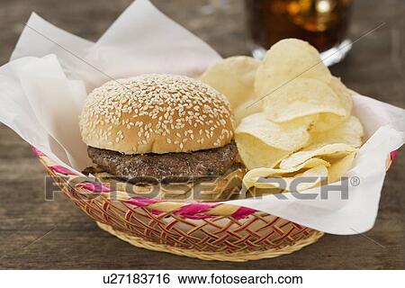 Stock Photograph - Hamburger and chips in basket. Fotosearch