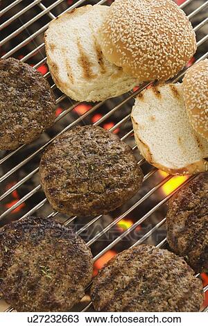 Hamburgers cooking on grill View Large Photo Image Stock Image - Hamburgers cooking on grill. Fotosearch