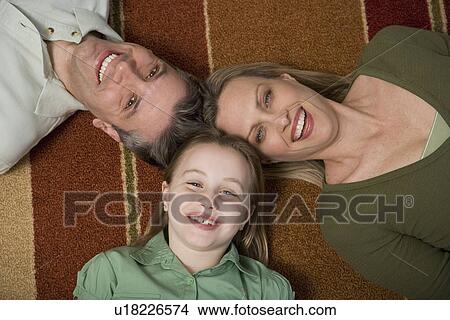 High angle view of family on floor View Large Photo Image Picture - High angle view of family on floor. Fotosearch