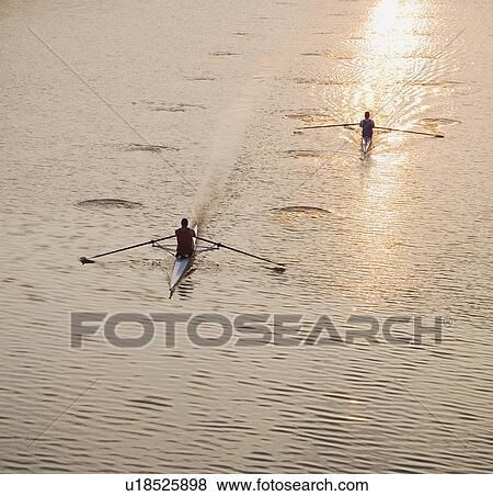 Stock Photo - High angle view of people sculling. Fotosearch
