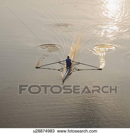 Stock Image - High angle view of person sculling. Fotosearch
