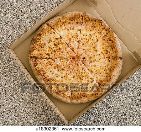 High angle view of pizza in box View Large Photo Image Stock Image - High angle view of pizza in box. Fotosearch