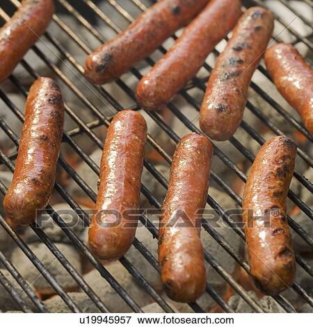 Hot dogs cooking on grill View Large Photo Image Stock Photo - Hot dogs cooking on grill. Fotosearch