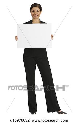 Indian businesswoman holding blank sign View Large Photo Image Stock Image - Indian businesswoman holding blank sign. Fotosearch