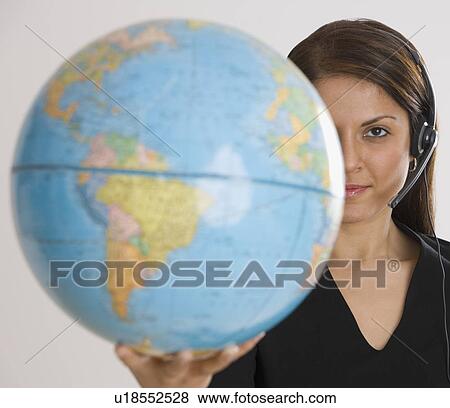 Stock Photo - Indian businesswoman holding globe. Fotosearch