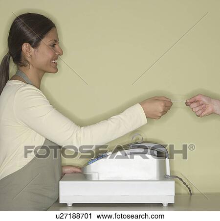 Indian female clerk accepting credit card View Large Photo Image Stock Image - Indian female clerk accepting credit card. Fotosearch