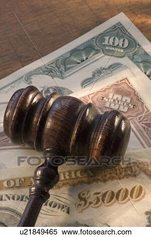 Stock Photography - Judge’s gavel on bank notes. Fotosearch