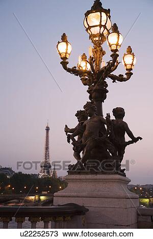 Lamp post with cherubs with Eiffel Tower in background View Large Photo Image Stock Image - Lamp post with cherubs with Eiffel Tower in background. Fotosearch