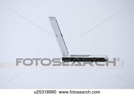Stock Image - Laptop on desk. Fotosearch