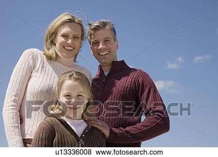 Low angle view of family View Large Photo Image Stock Photo - Low angle view of family . Fotosearch
