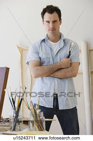 Male artist in painting studio View Large Photo Image Stock Image - Male artist in painting studio. Fotosearch