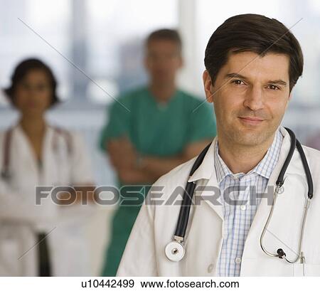 Stock Photo - Male doctor wearing stethoscope. Fotosearch