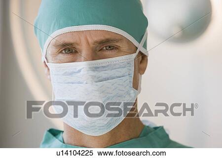 Male doctor wearing surgical mask View Large Photo Image Stock Photography - Male doctor wearing surgical mask. Fotosearch