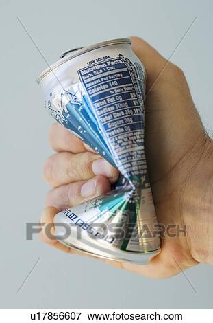 Man crushing tin can View Large Photo Image Stock Photo - Man crushing tin can. Fotosearch