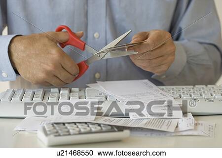 Man cutting up credit card View Large Photo Image Stock Image - Man cutting up credit card. Fotosearch