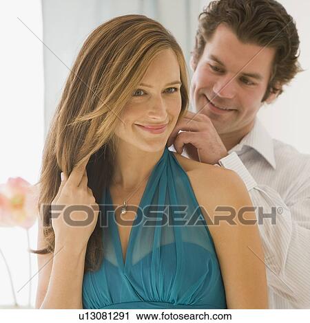 Man fastening wife's necklace View Large Photo Image Stock Image - Man fastening wife's necklace. Fotosearch