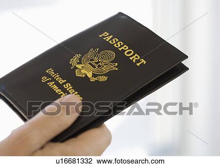 Man holding passport View Large Photo Image Stock Image - Man holding passport. Fotosearch