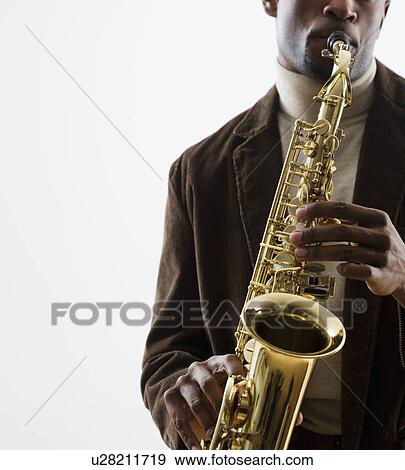 Stock Photo - Man playing saxophone. Fotosearch