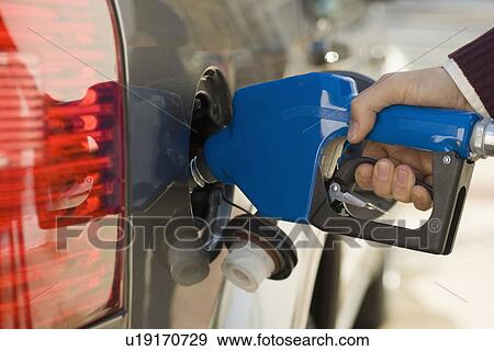 Man pumping gas View Large Photo Image Stock Photo - Man pumping gas. Fotosearch