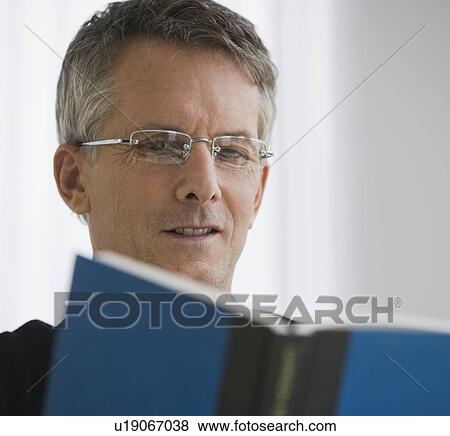 Stock Photo - Man reading book. Fotosearch